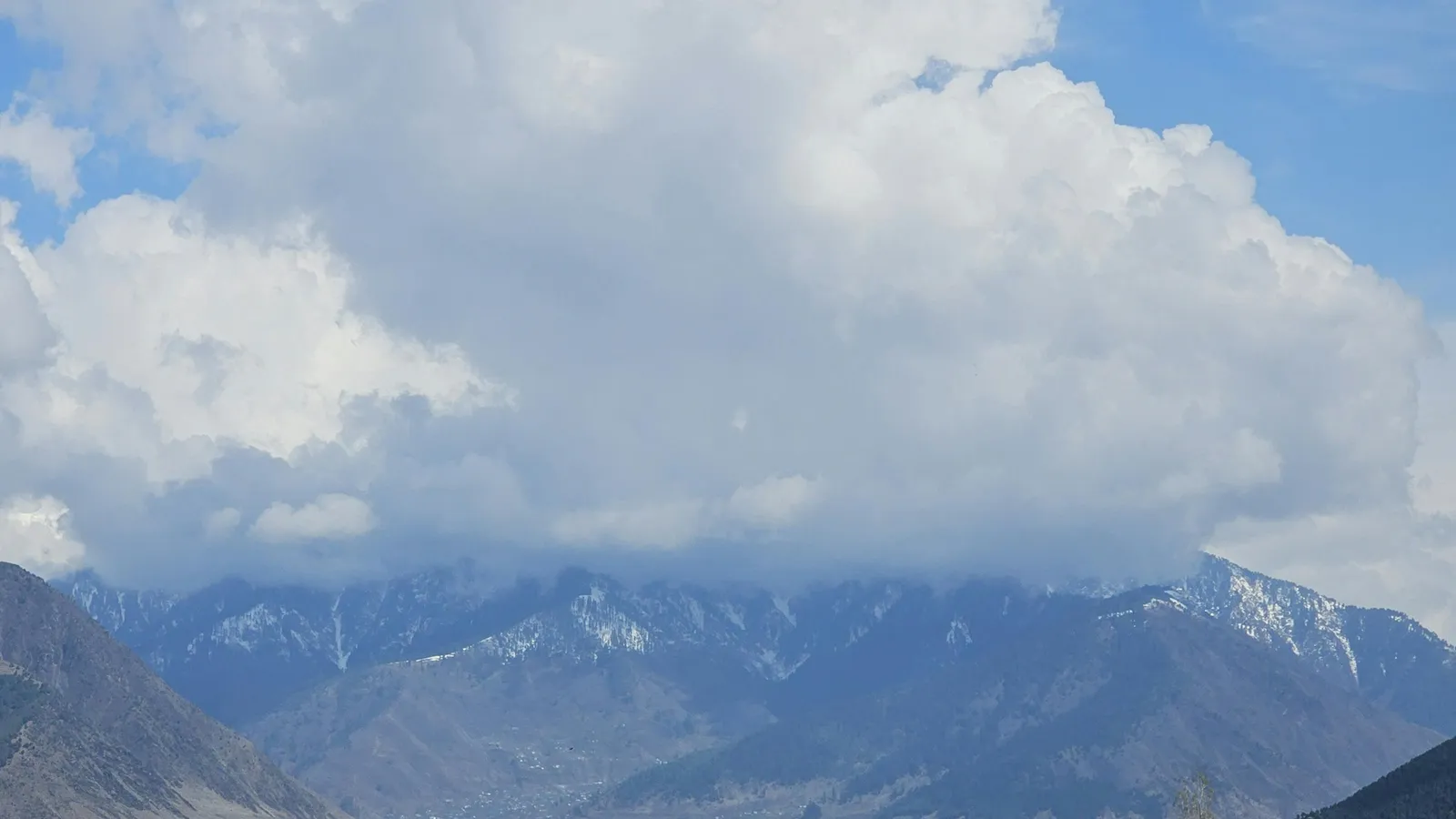 Kashmir valley changing seasons with mountains