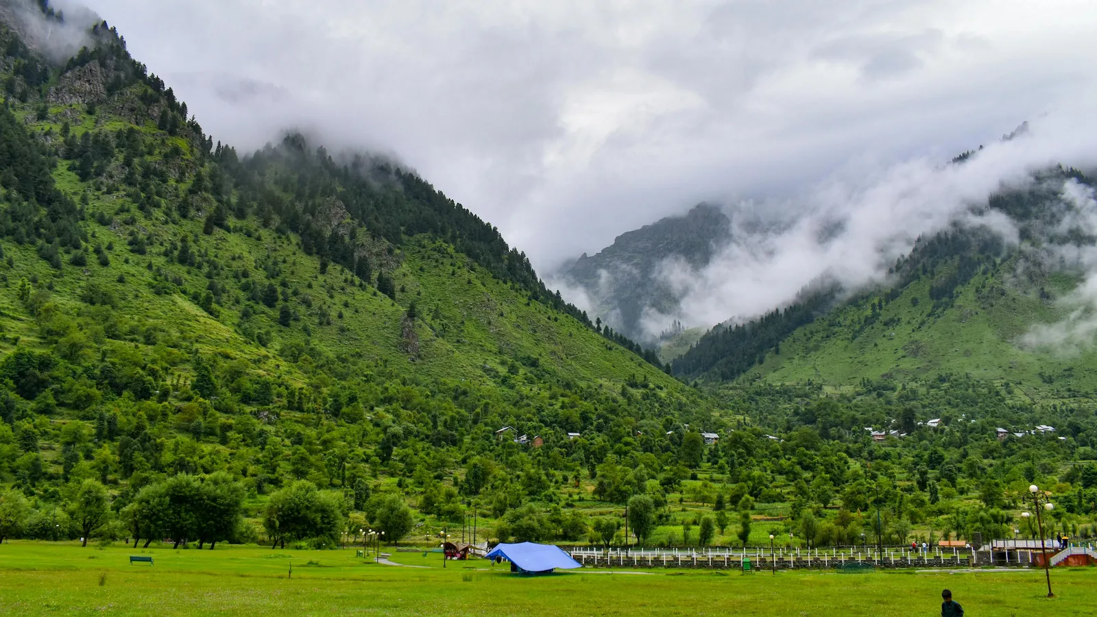 Misty mountains in Kashmir valley with lush green landscape