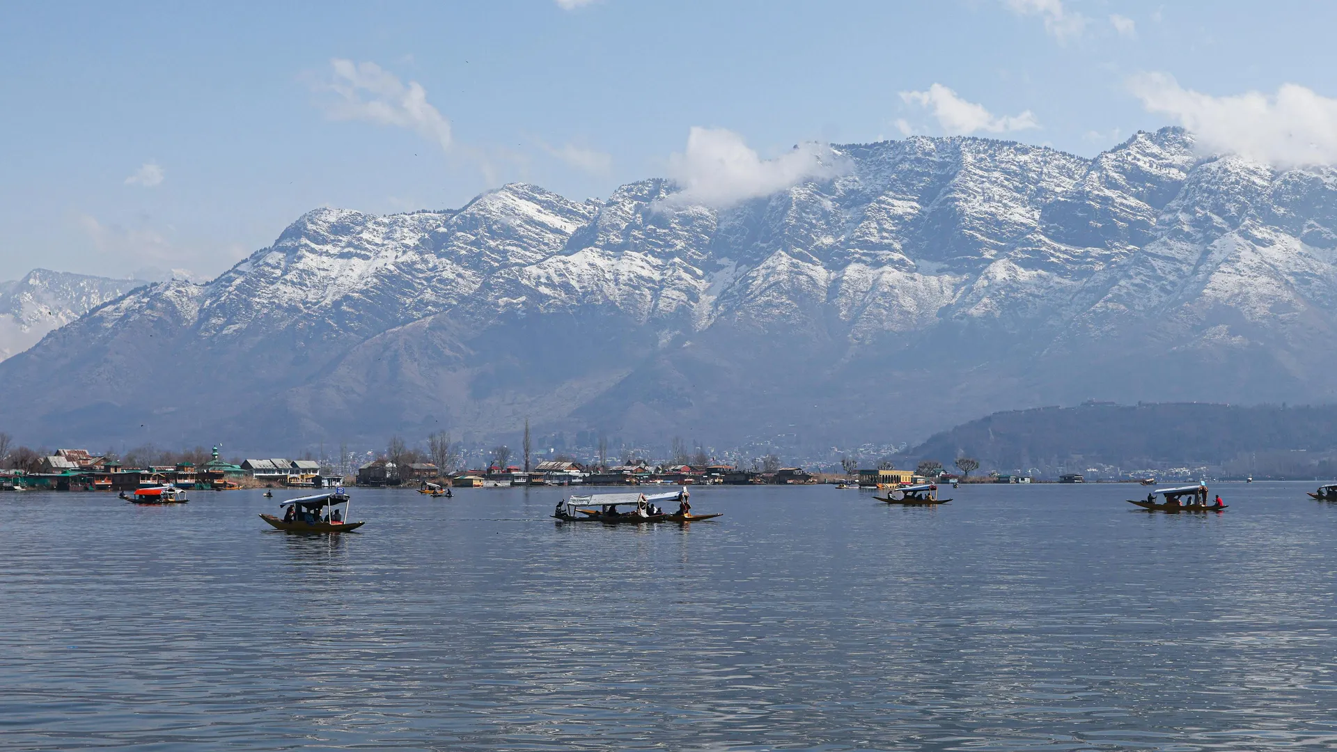 Shikaras on Dal Lake with the Himalayas